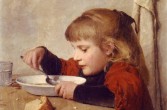 Dziewczynka jedząca zupę